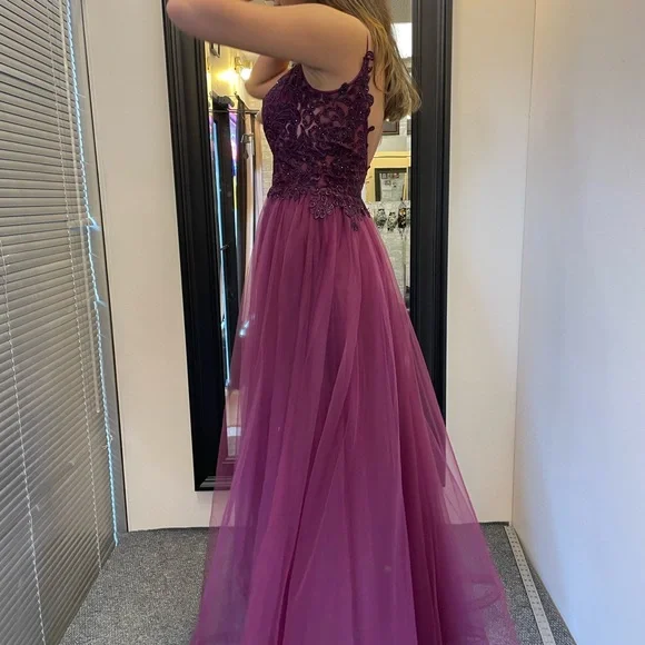 A beautiful size four grad dress, altered to fit size 2-4 in length and waist. - Picture 2 of 3